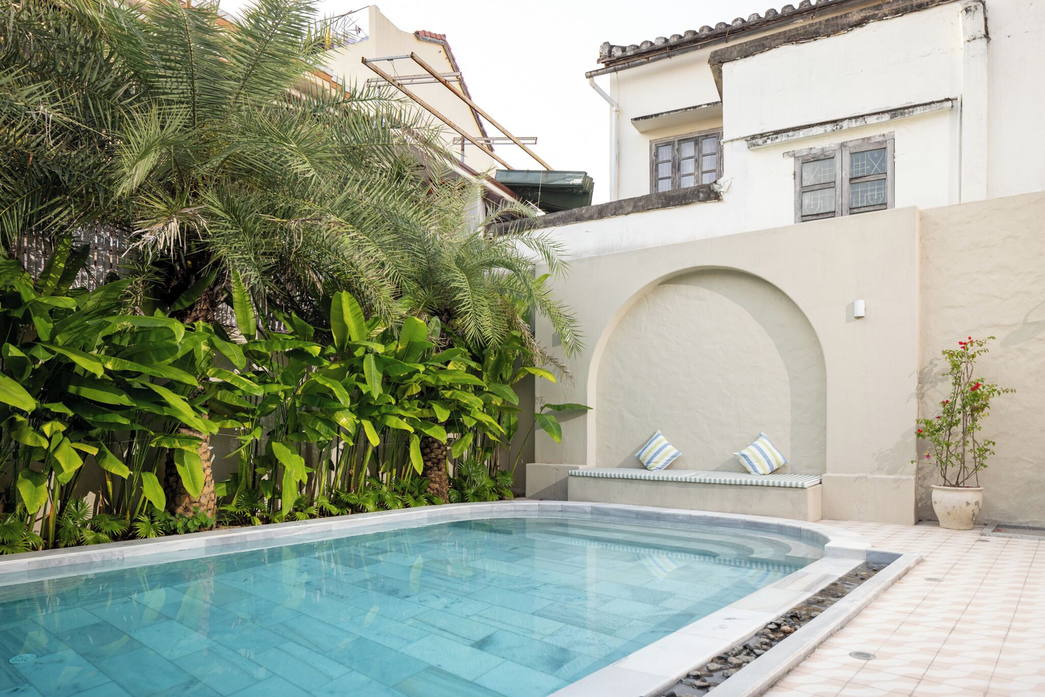 outdoor pool, pool umbrellas, pool loungers