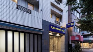 A building with a tiled facade, a blue awning, and a sign for 'Four Points Flex' hotel. - Four Points Flex By Sheraton Tokyo Ueno (Tokyo)