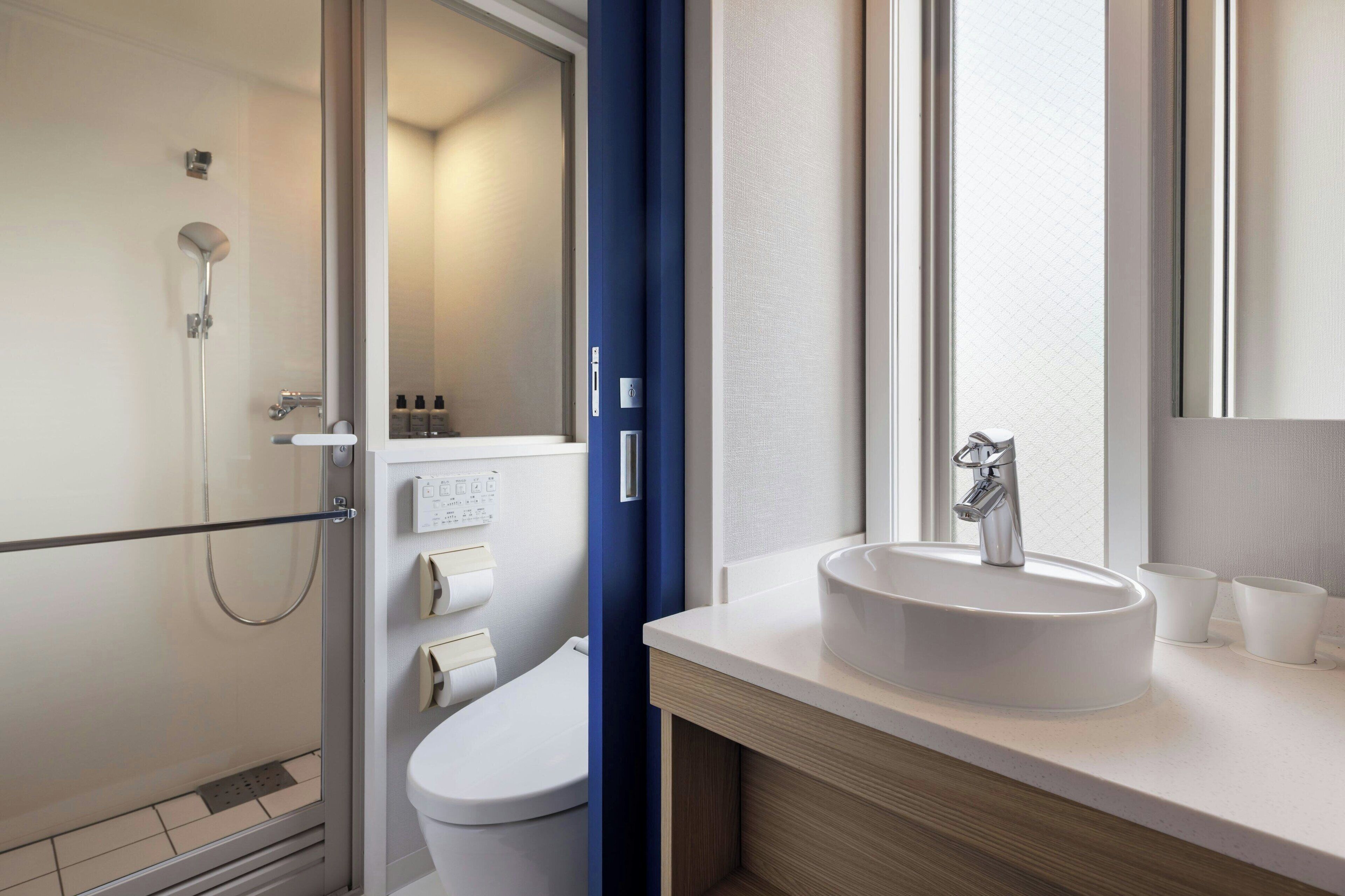 Shower, free toiletries, hair dryer, slippers