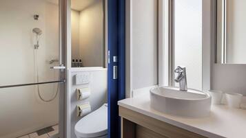 Shower, free toiletries, hair dryer, slippers