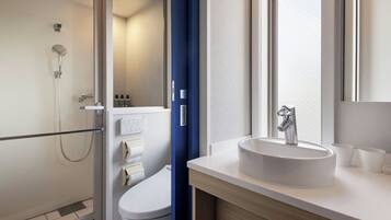 Shower, free toiletries, hair dryer, slippers