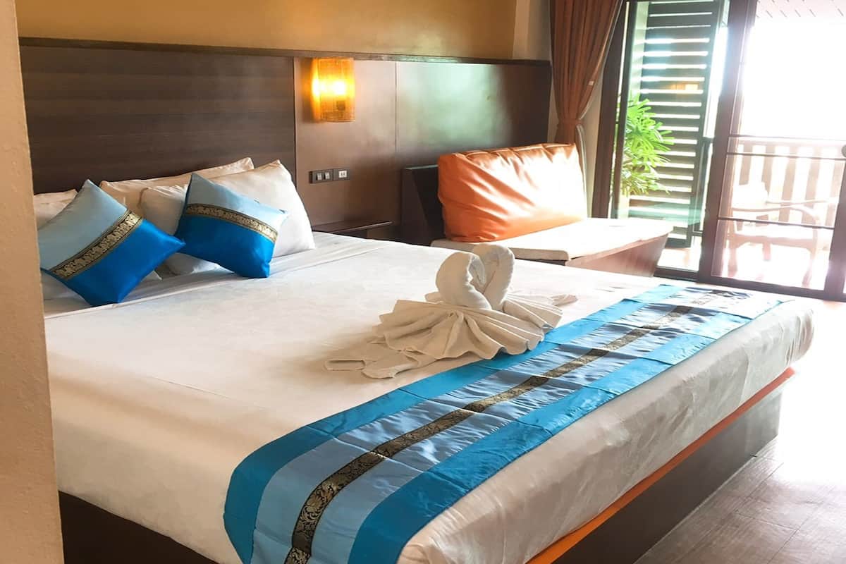 Superior Room, Balcony, Pool View | Living area | Flat-screen TV