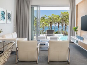 One Bed Penthouse Pool Suite | Living area | 55-inch Smart TV with digital channels, TV