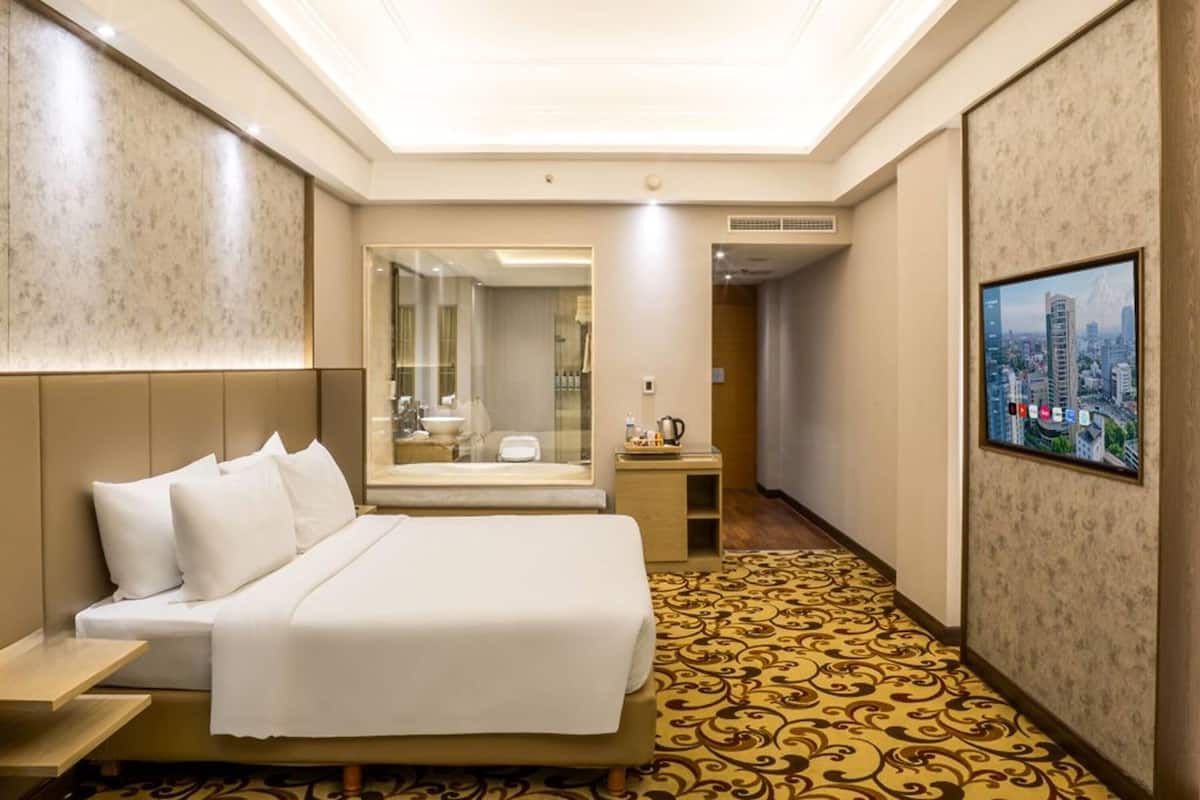 Habitación Deluxe, 1 cama de matrimonio grande (Grand) | Ropa de cama de alta calidad, minibar, caja fuerte y escritorio