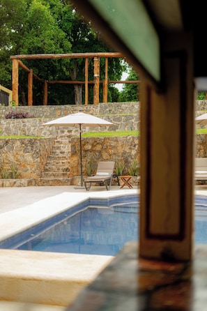 Outdoor pool, open 8:00 AM to 8:00 PM, pool umbrellas