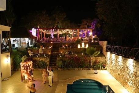 Outdoor pool, open 8:00 AM to 8:00 PM, pool umbrellas