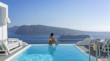 Seasonal outdoor pool, pool umbrellas, pool loungers