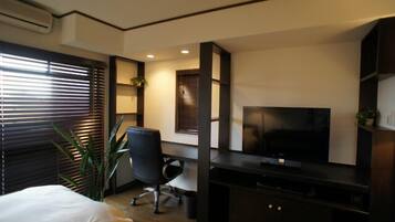 Economy Double Room, Non Smoking | Living area | LCD TV, DVD player