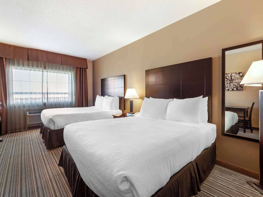 Premium bedding, pillow-top beds, desk, laptop workspace