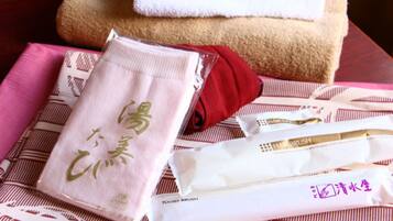 Combined shower/tub, free toiletries, hair dryer, slippers