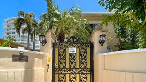 A gated entrance to a hotel with a sign indicating it is the Winterset Hotel.