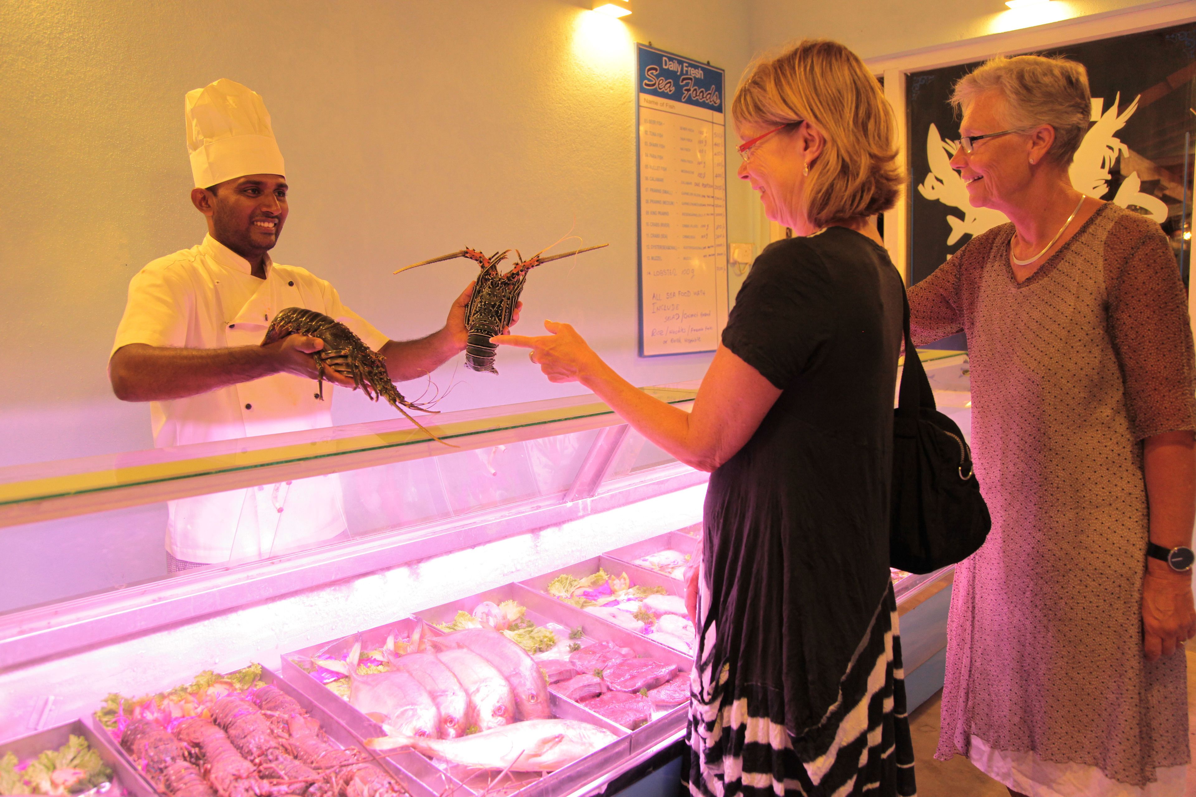 A seafood display with various types of fish and seafood.