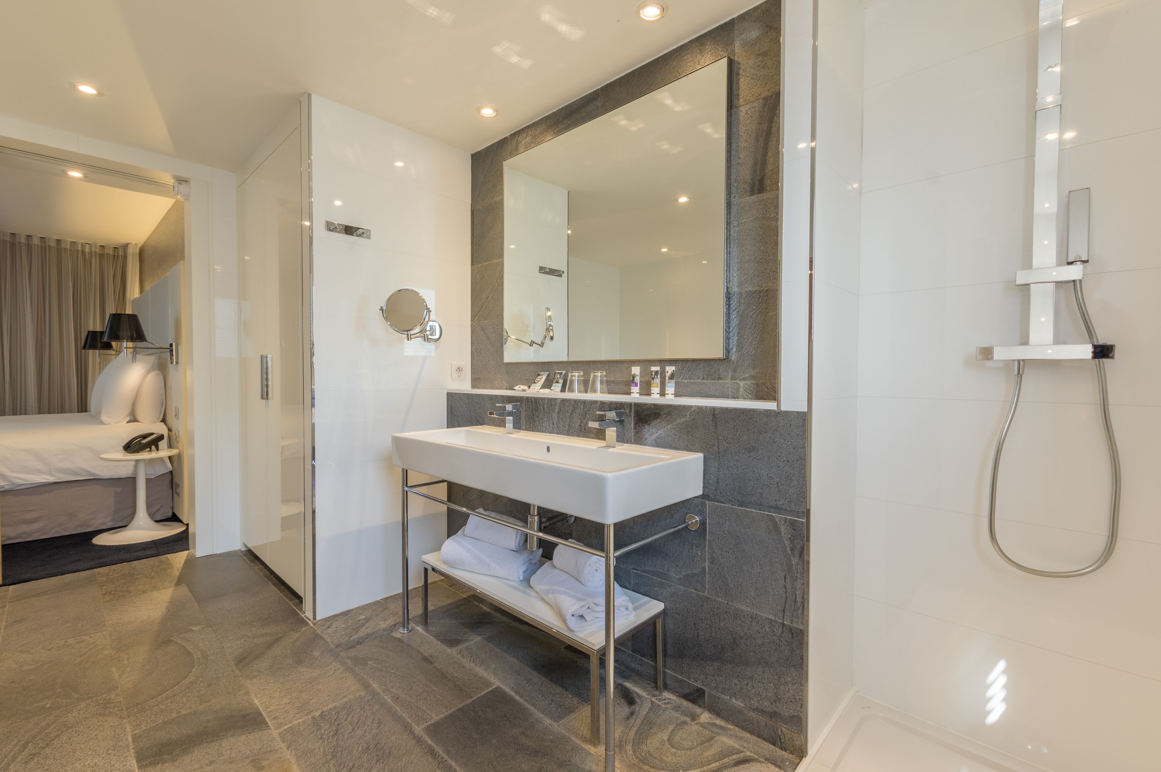 rainfall showerhead, eco-friendly toiletries, hair dryer, towels