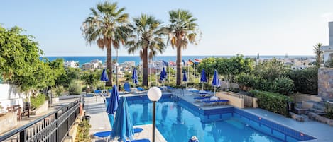 Seasonal outdoor pool, pool loungers