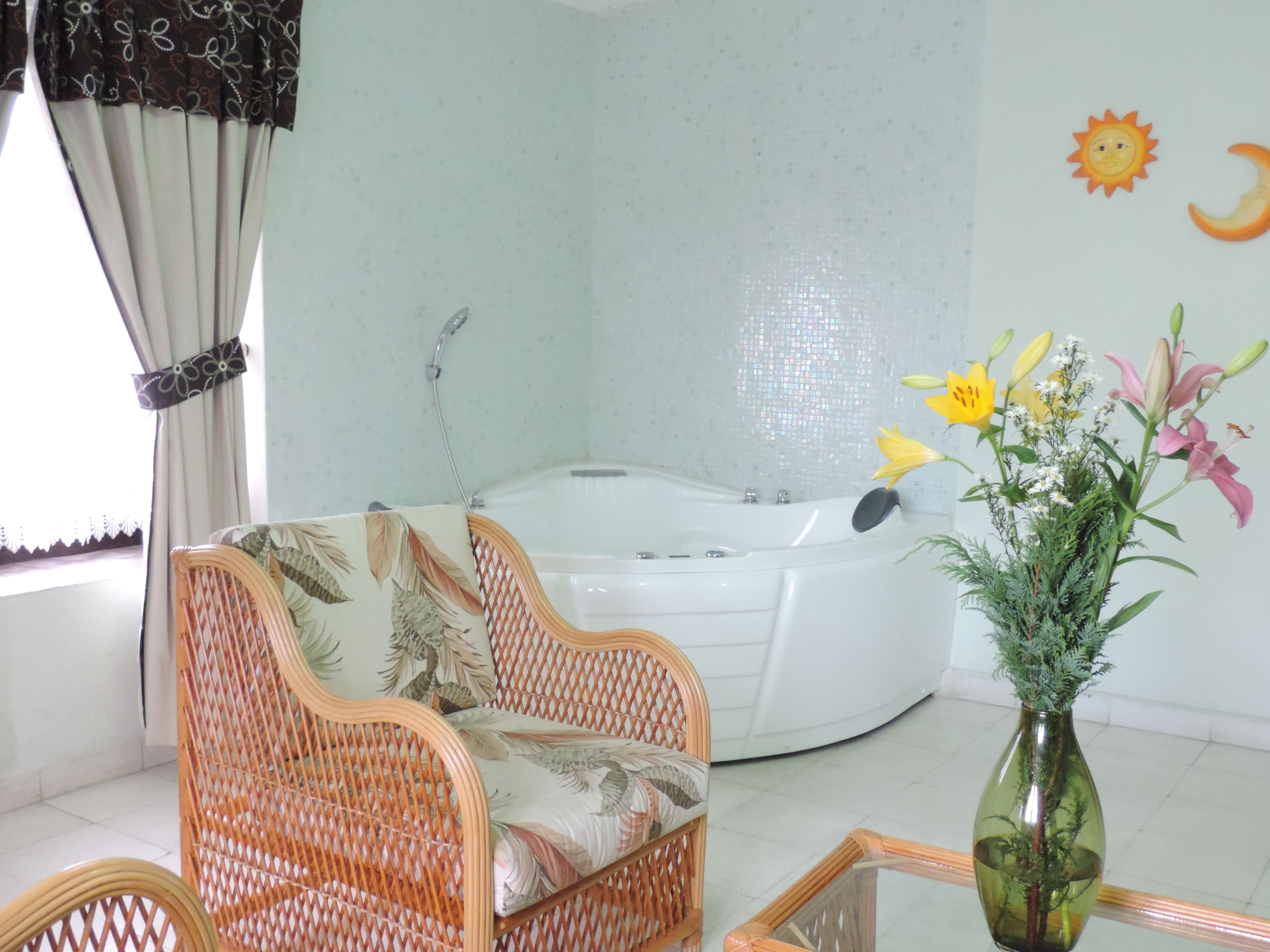 romantic suite with jacuzzi and living area (bugambilias) | 1 bedroom, down duvets, minibar, in-room safe