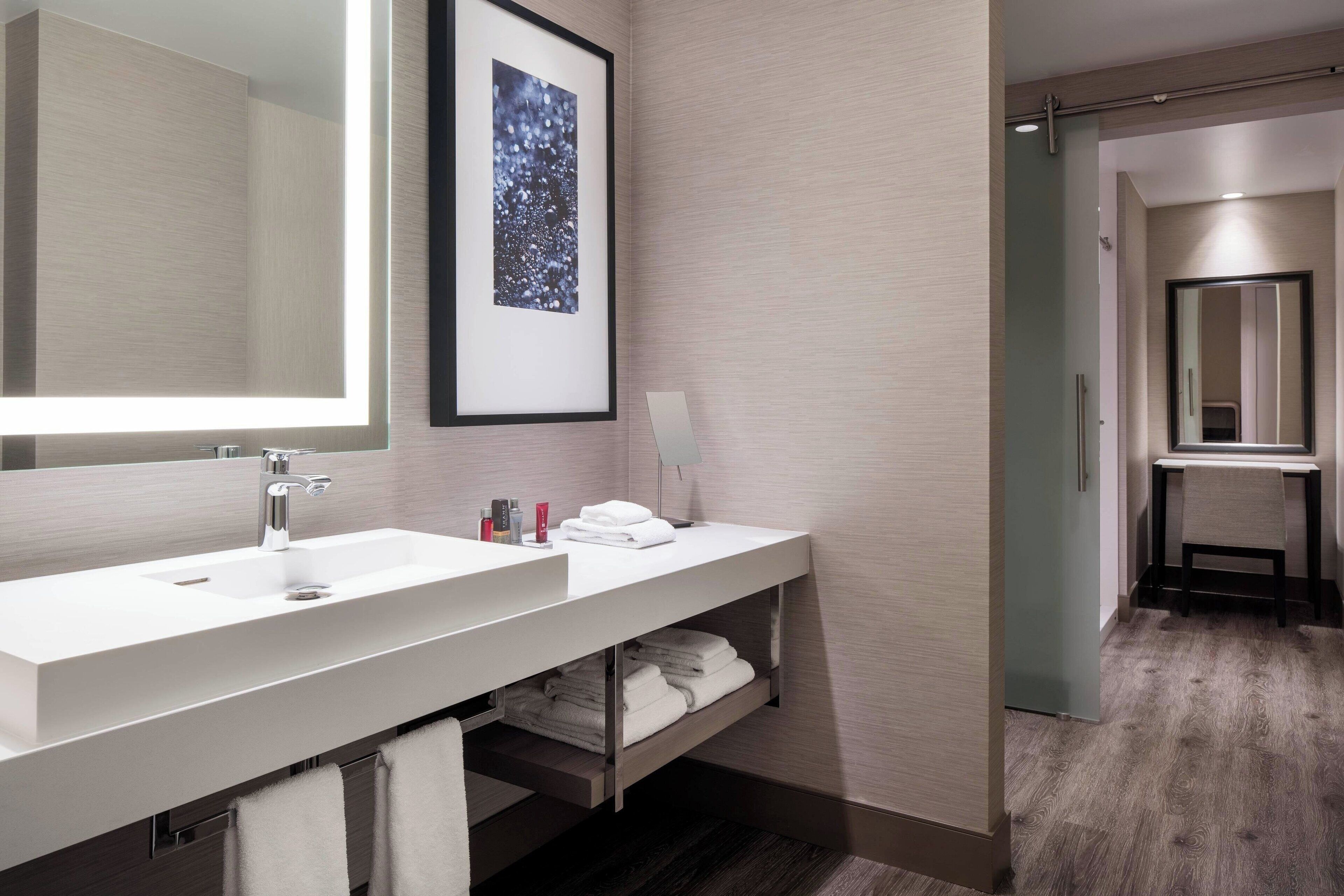 eco-friendly toiletries, hair dryer, slippers, towels