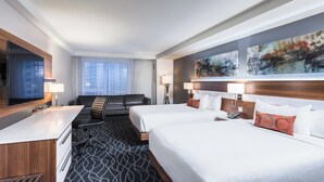 A hotel room with a large bed, a desk, a TV, and a painting on the wall. - Delta Hotels by Marriott Waterloo (Waterloo)