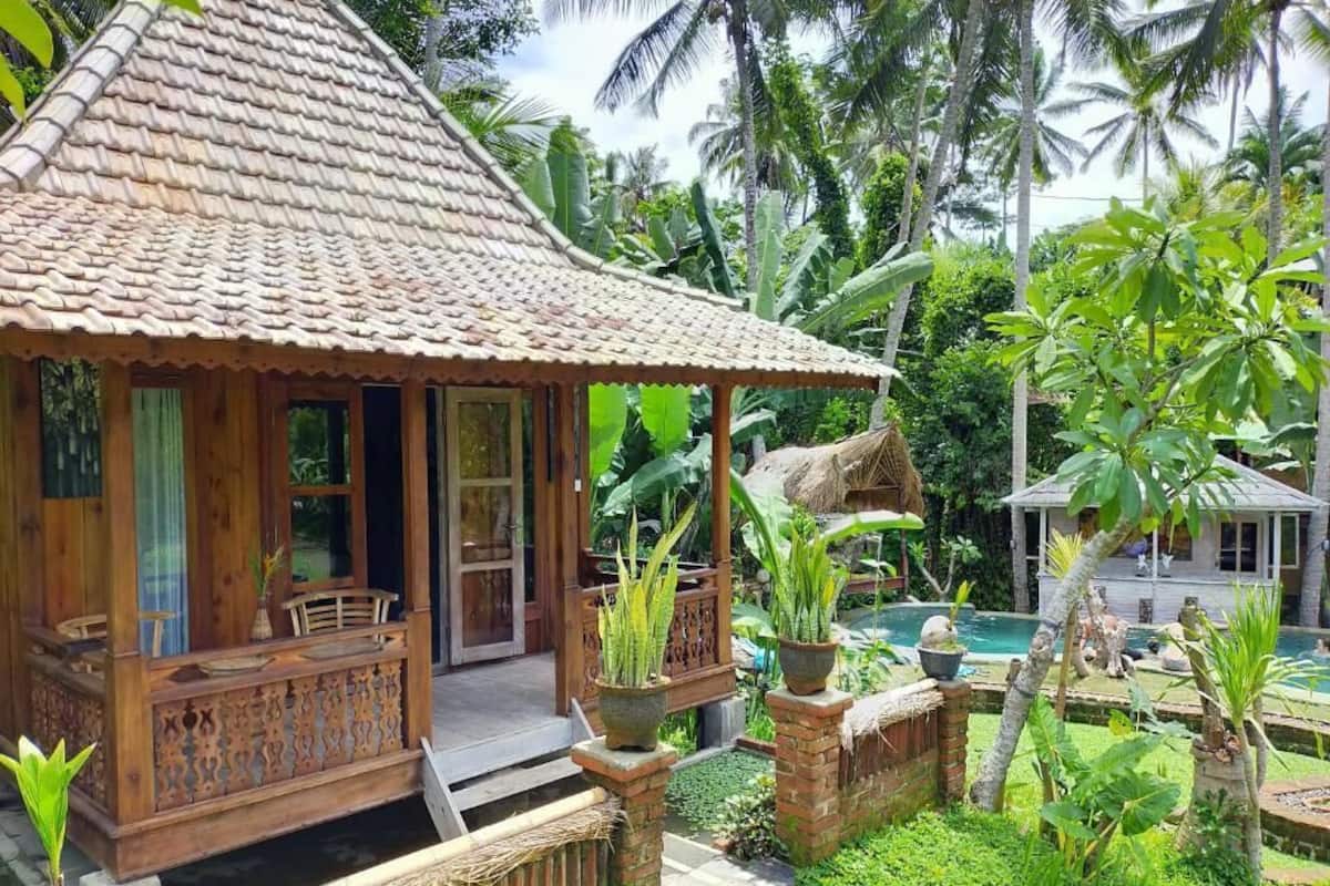 Wooden One-Bedroom Cottage with Rice Field View | 1 bedroom, minibar, in-room safe, individually decorated