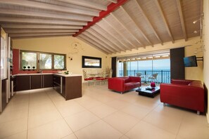 Panoramic Penthouse, Terrace, Sea View | Living area | 20-inch TV with cable channels - Batelo Boutique Hotel - Adults Only (Corfu)