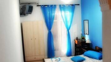 Kamer, 1 twee- of 2 eenpersoonsbedden | Een strijkplank/strijkijzer, gratis wifi