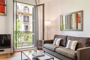 Superior Apartment, 4 Bedrooms | Living area | 37-inch flat-screen TV with digital channels