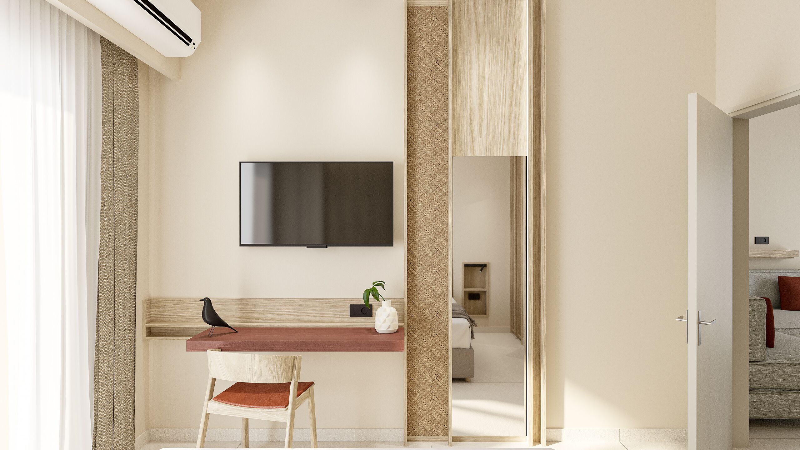 A modern hotel room with a flat-screen TV mounted on the wall, a wooden desk with a chair, and a small potted plant.