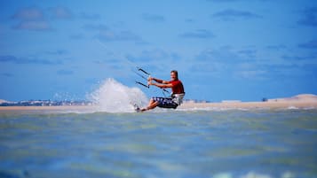 A person windsurfing on a clear day.