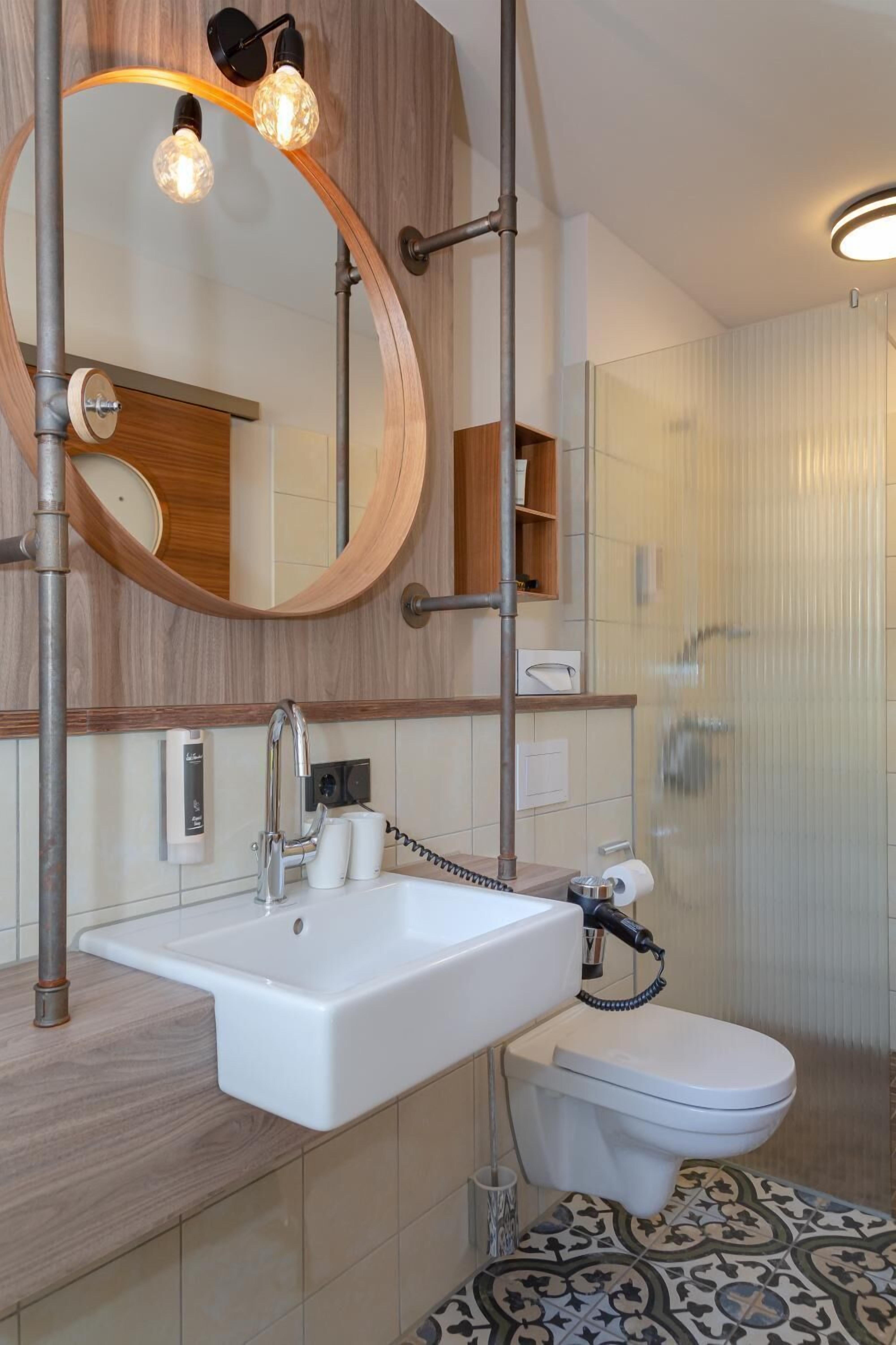 shower, hair dryer, slippers, towels