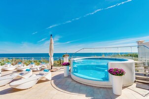 Seasonal outdoor pool, open 7:00 AM to 8:00 PM, pool umbrellas