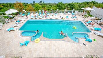 Seasonal outdoor pool, open 7:00 AM to 8:00 PM, pool umbrellas