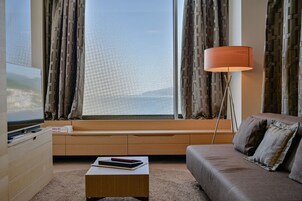 Deluxe Suite, Jetted Tub, Sea View | Living area | 48-inch flat-screen TV with cable channels, TV