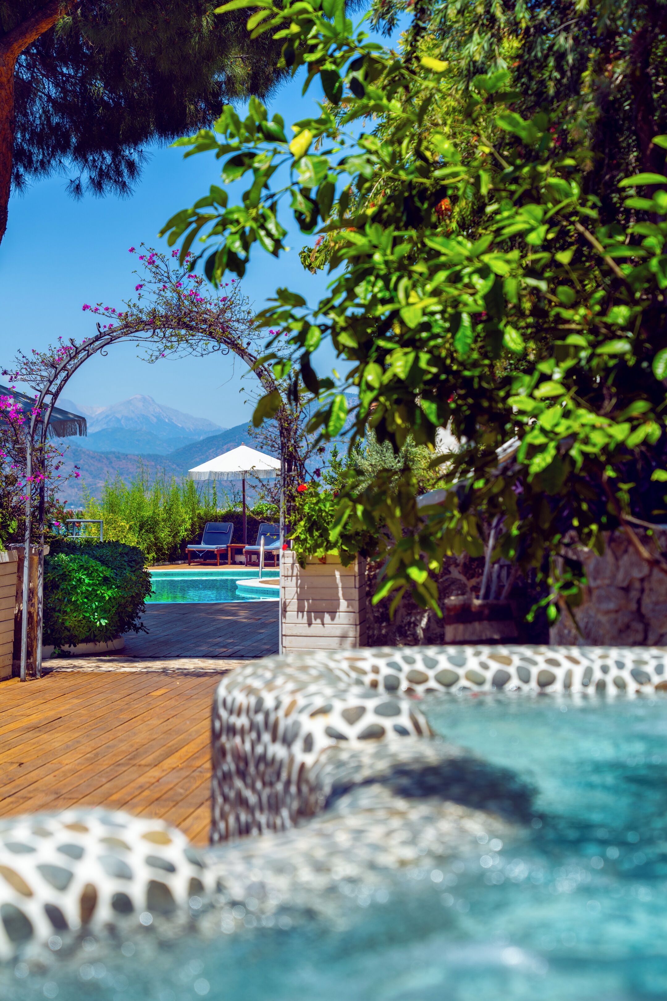 Outdoor pool, a heated pool, free pool cabanas, pool umbrellas