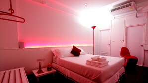 A room with a bed, bedside table, and a red chair. - U431 Chaengwattana (Pak Kret)