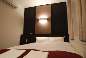 Down comforters, desk, laptop workspace, blackout drapes