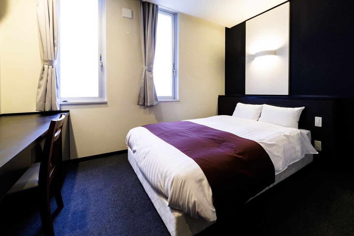 Down duvets, desk, laptop workspace, blackout curtains