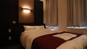 Down duvets, desk, laptop workspace, blackout curtains