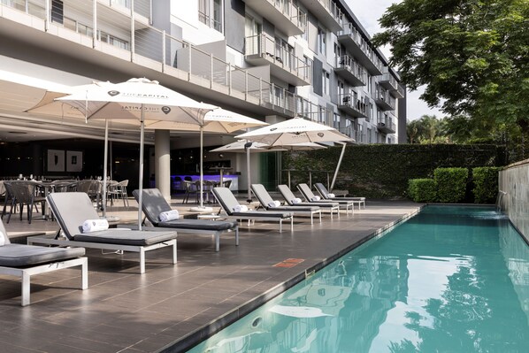 Outdoor pool, pool umbrellas, pool loungers