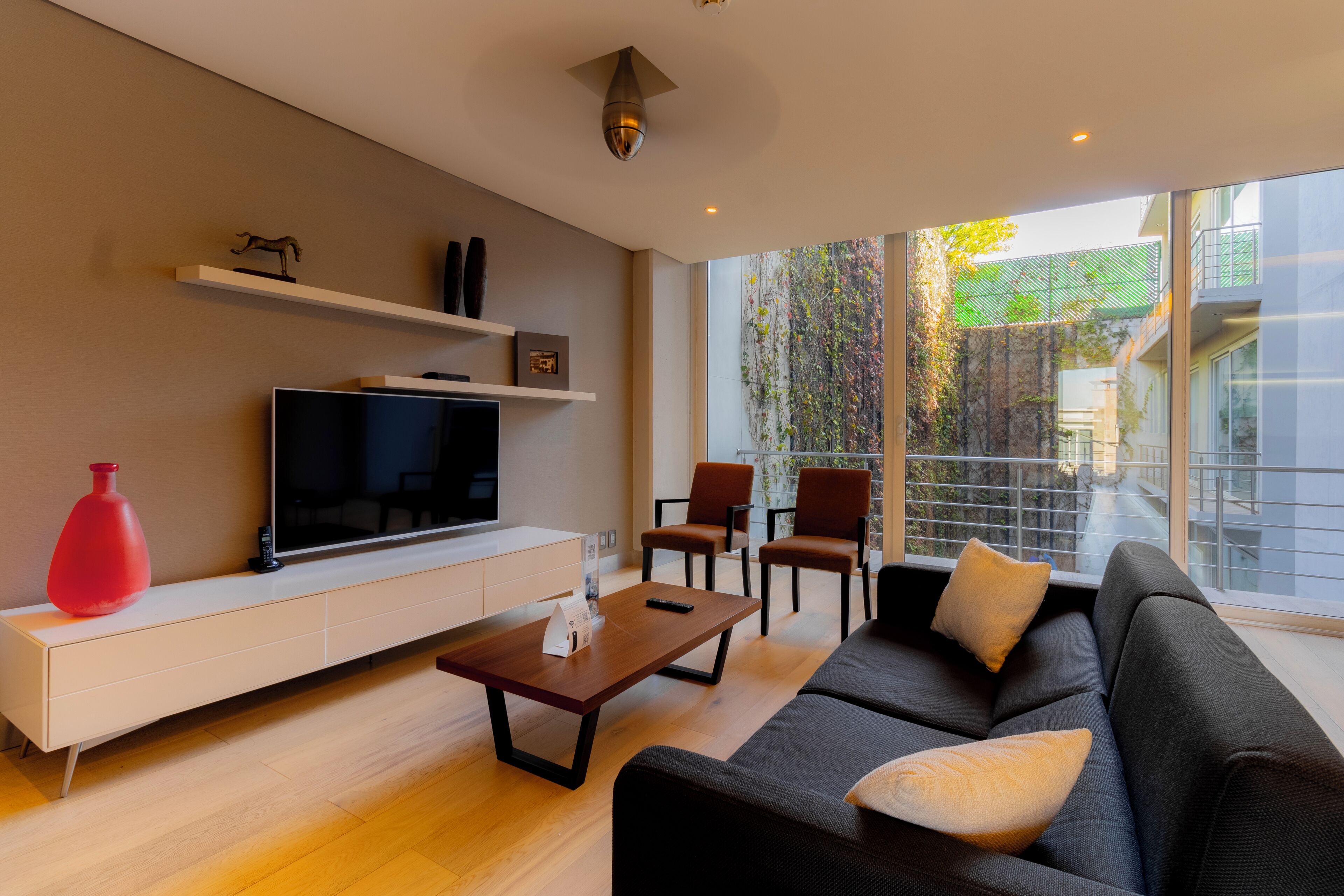 Junior Suite, Balcony | Living area | 39-inch flat-screen TV with cable channels, TV