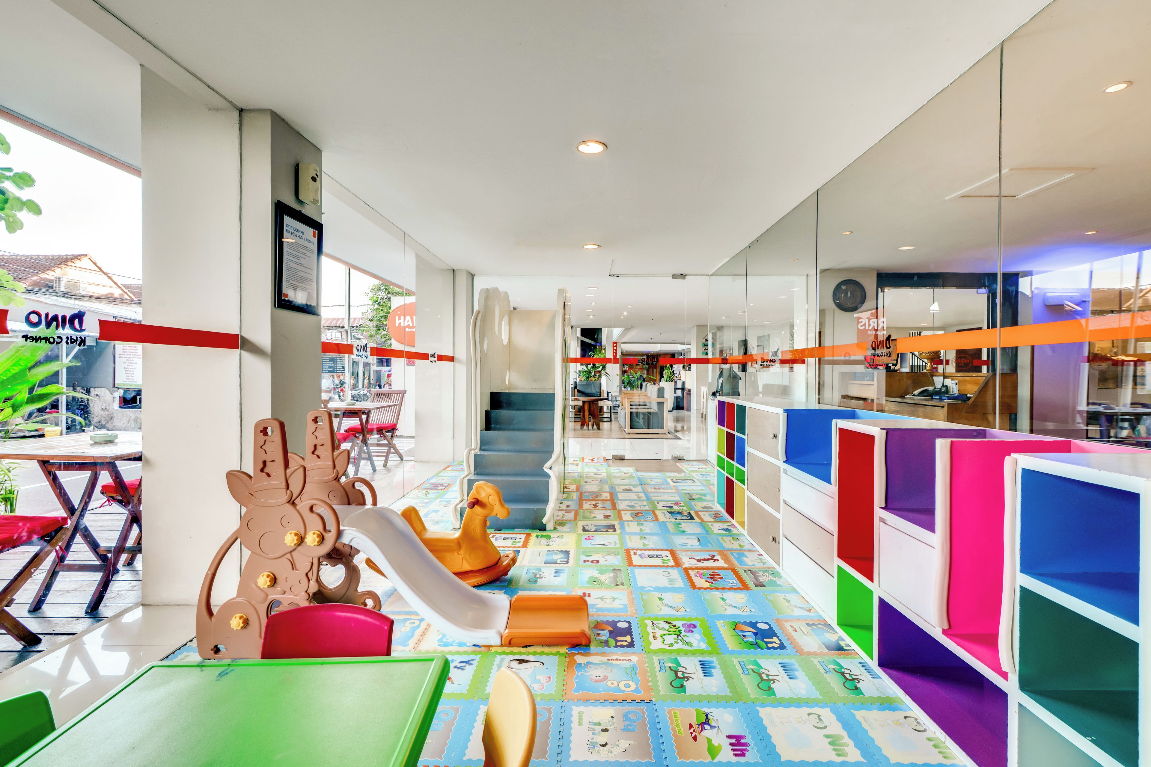 A children's play area with colorful furniture and a play mat.
