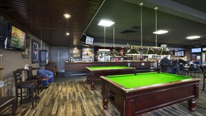 A billiards room with a pool table, bar area, and seating. - Nightcap at Morwell Hotel (Morwell)