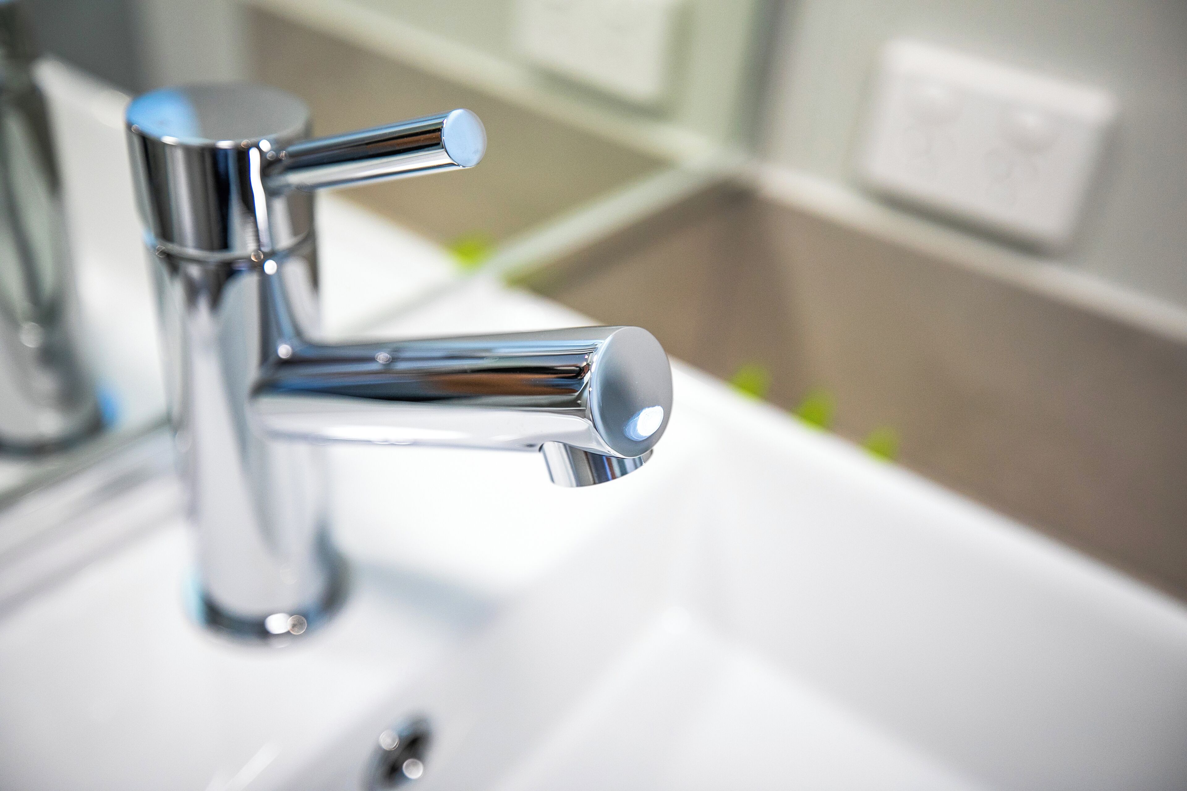 A modern bathroom sink with a chrome faucet.