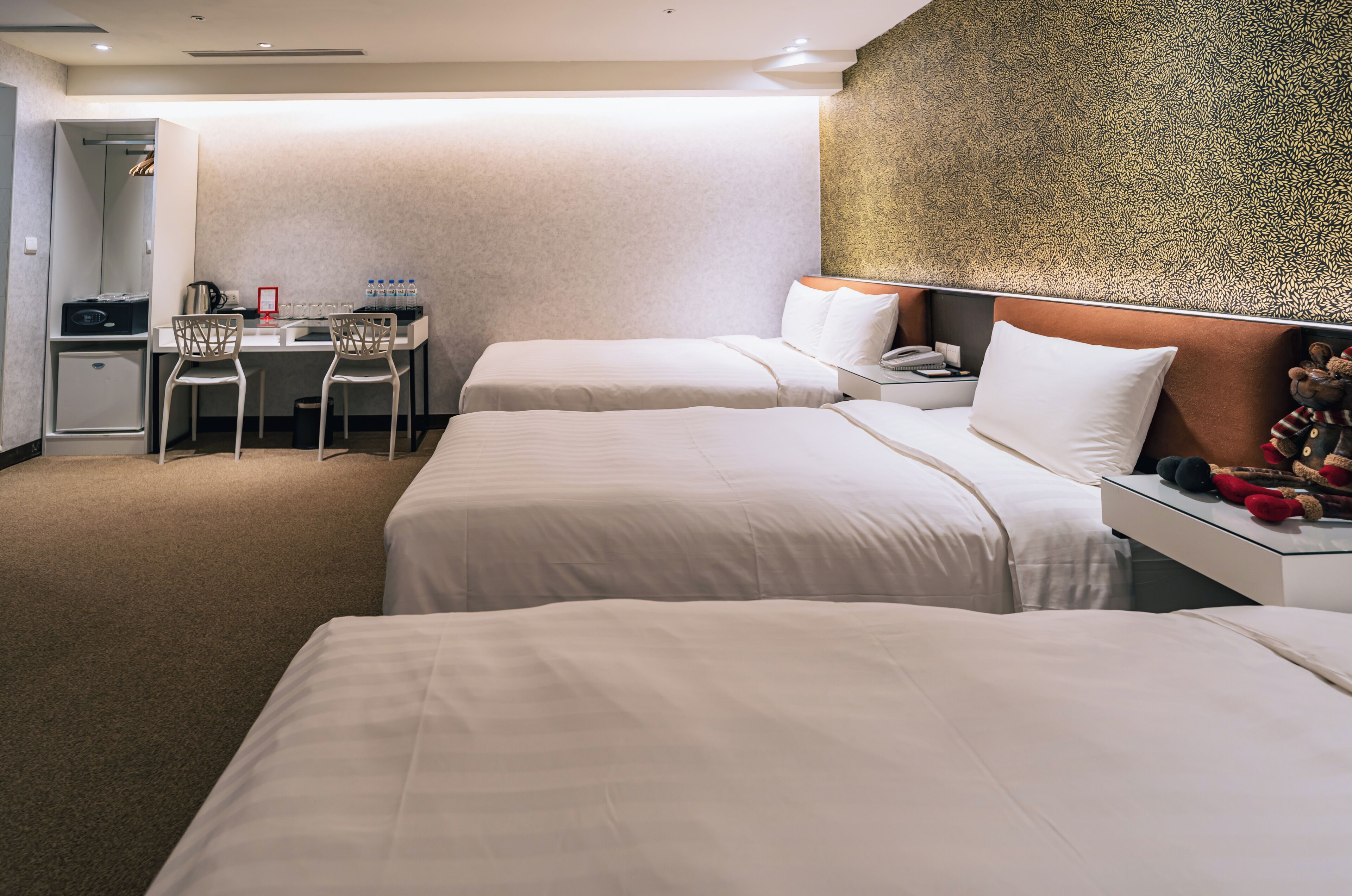 grand room, multiple beds, non smoking, no windows | in-room safe, desk, iron/ironing board, free wifi