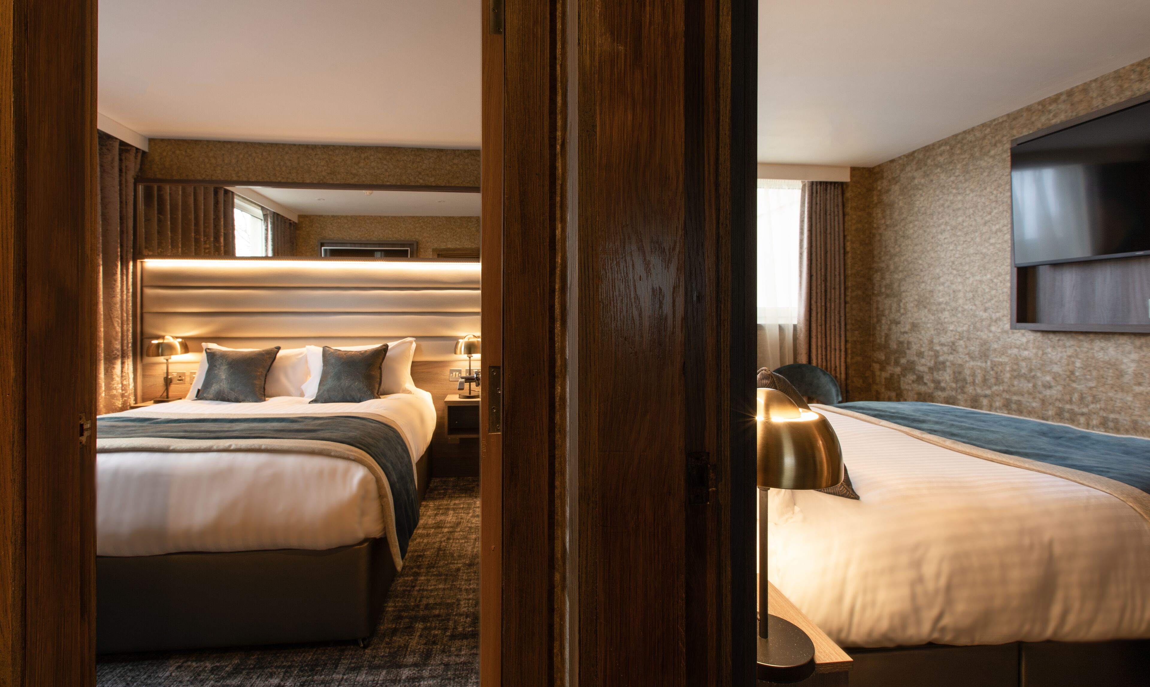 classic family room | desk, laptop workspace, blackout curtains, iron/ironing board