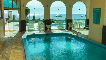 Indoor pool, outdoor pool, pool umbrellas