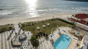 On the beach, sun-loungers, beach umbrellas