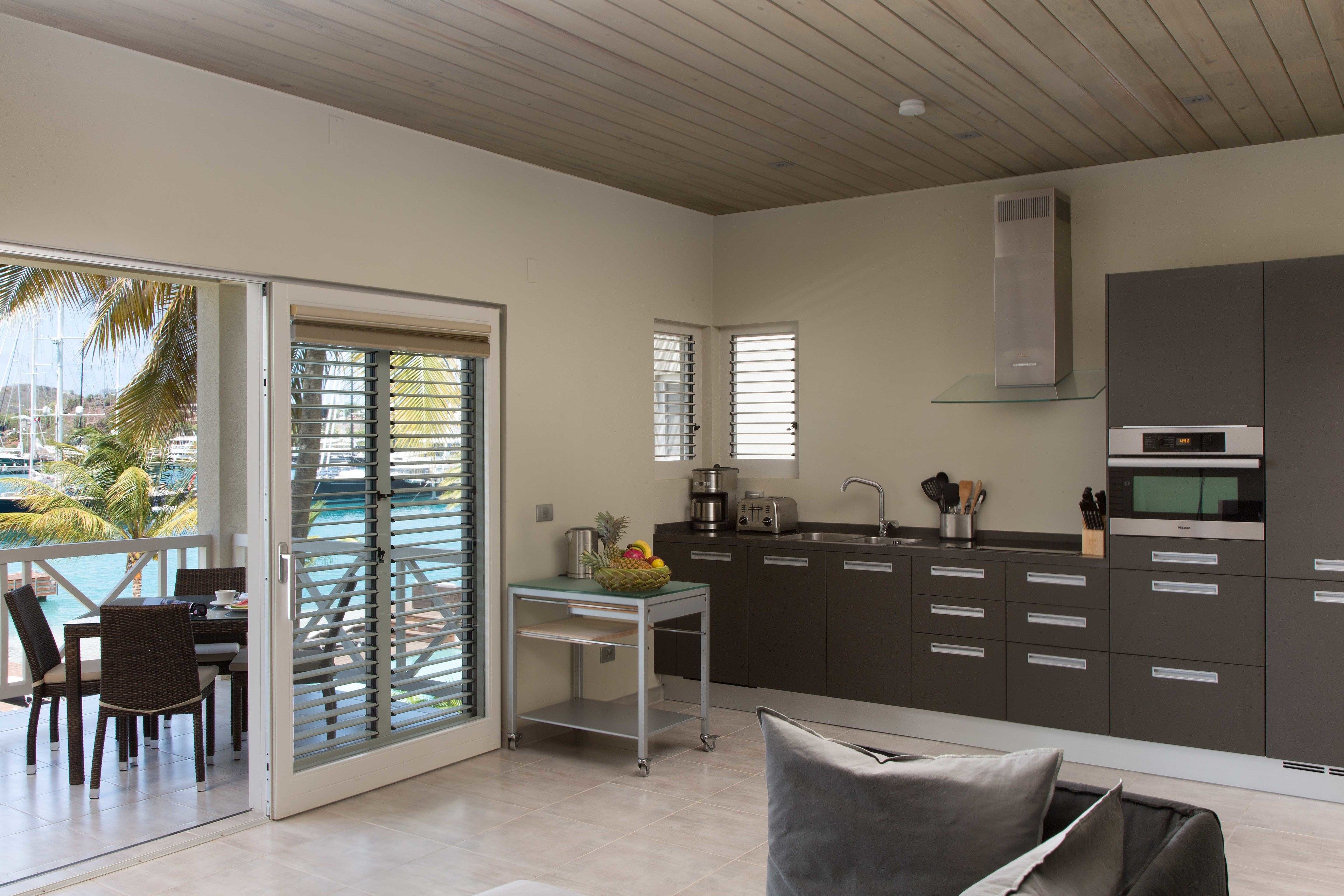 deluxe suite, 1 bedroom, balcony, marina view | private kitchen | full-sized fridge, microwave, stovetop, dishwasher