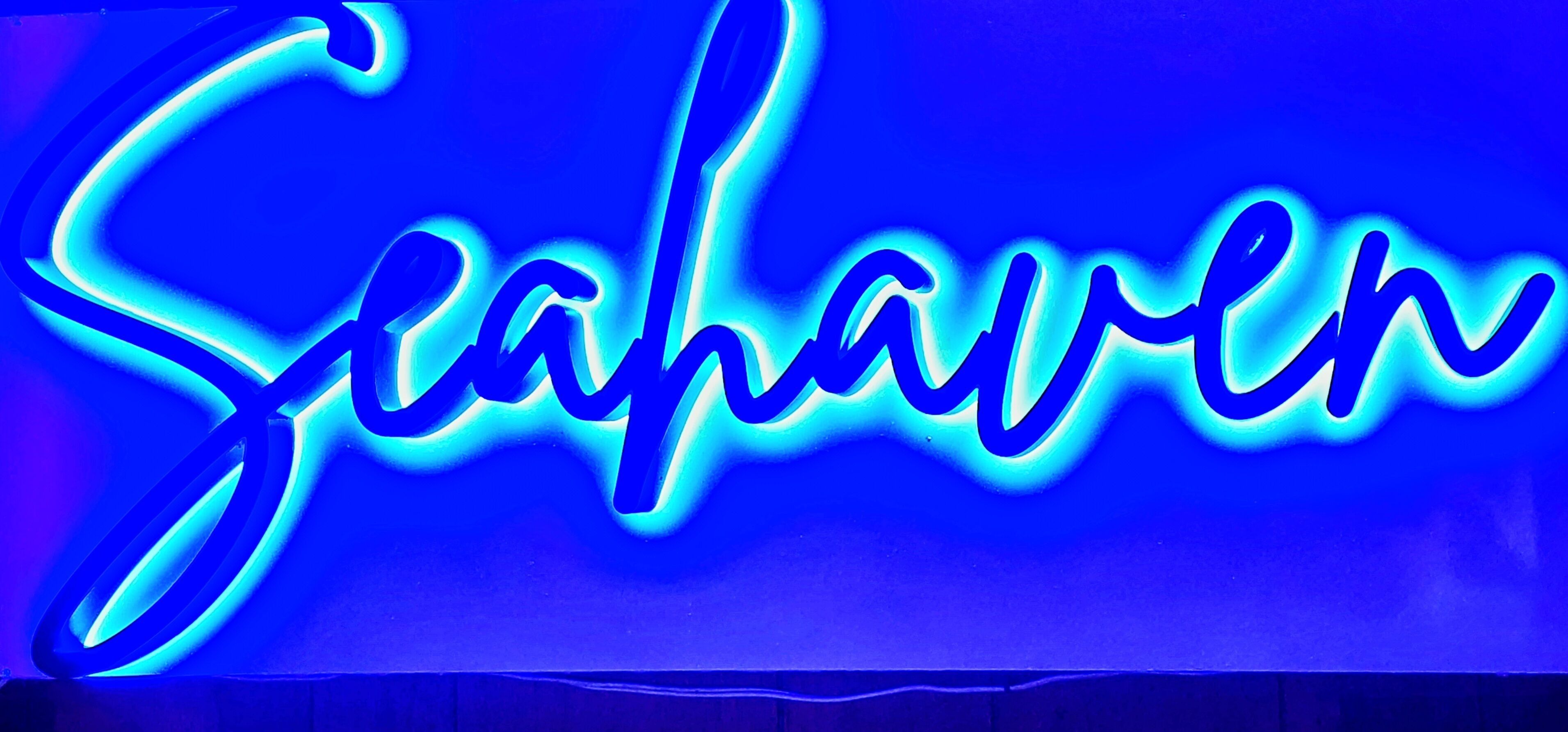 A neon sign spelling "Seahaven" in cursive.