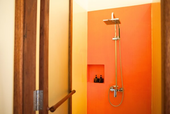 A shower with a handheld showerhead and a wall-mounted control panel. - iRoHa Garden Hotel & Resort (Phnom Penh)