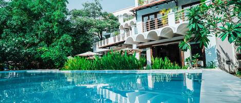 Outdoor pool, open 7 AM to 10 PM, free cabanas, pool umbrellas