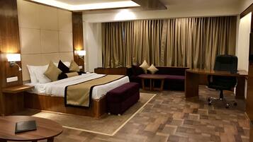 Luxury Suite, 1 King Bed, Jetted Tub, Pool View | In-room safe, individually decorated, individually furnished, desk